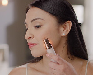 Girl using SimplySmooth on her cheek